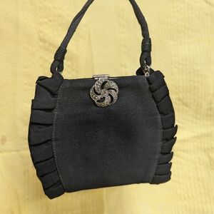 #2 vintage black evening bag with ruffled detailing and a decorative clasp